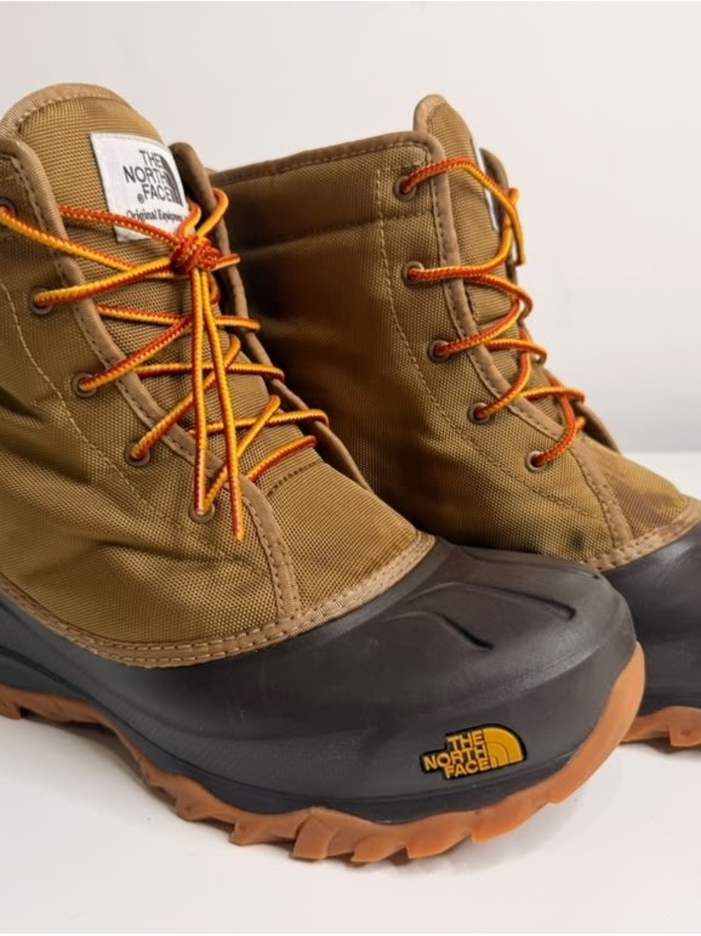The North Face Men's Tan and Black Insulated Lace-Up Boots with Orange Accents